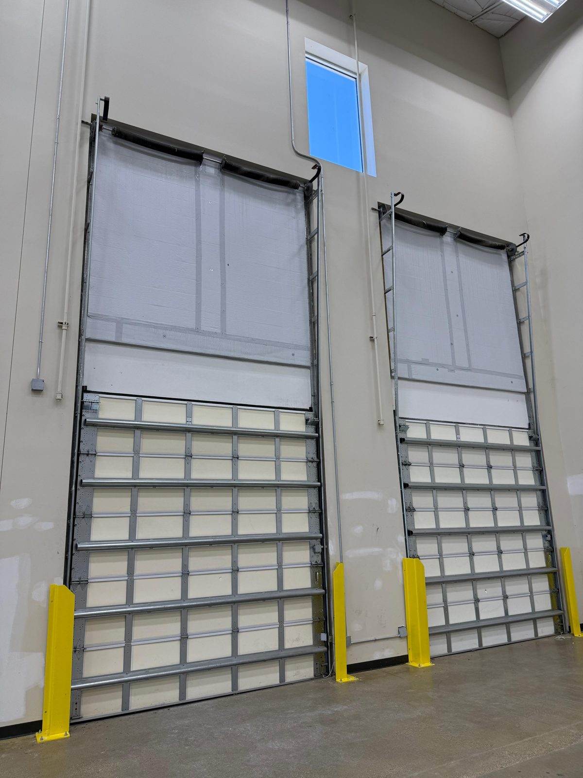 Commercial roll-up warehouse door serviced by TikTak in Houston