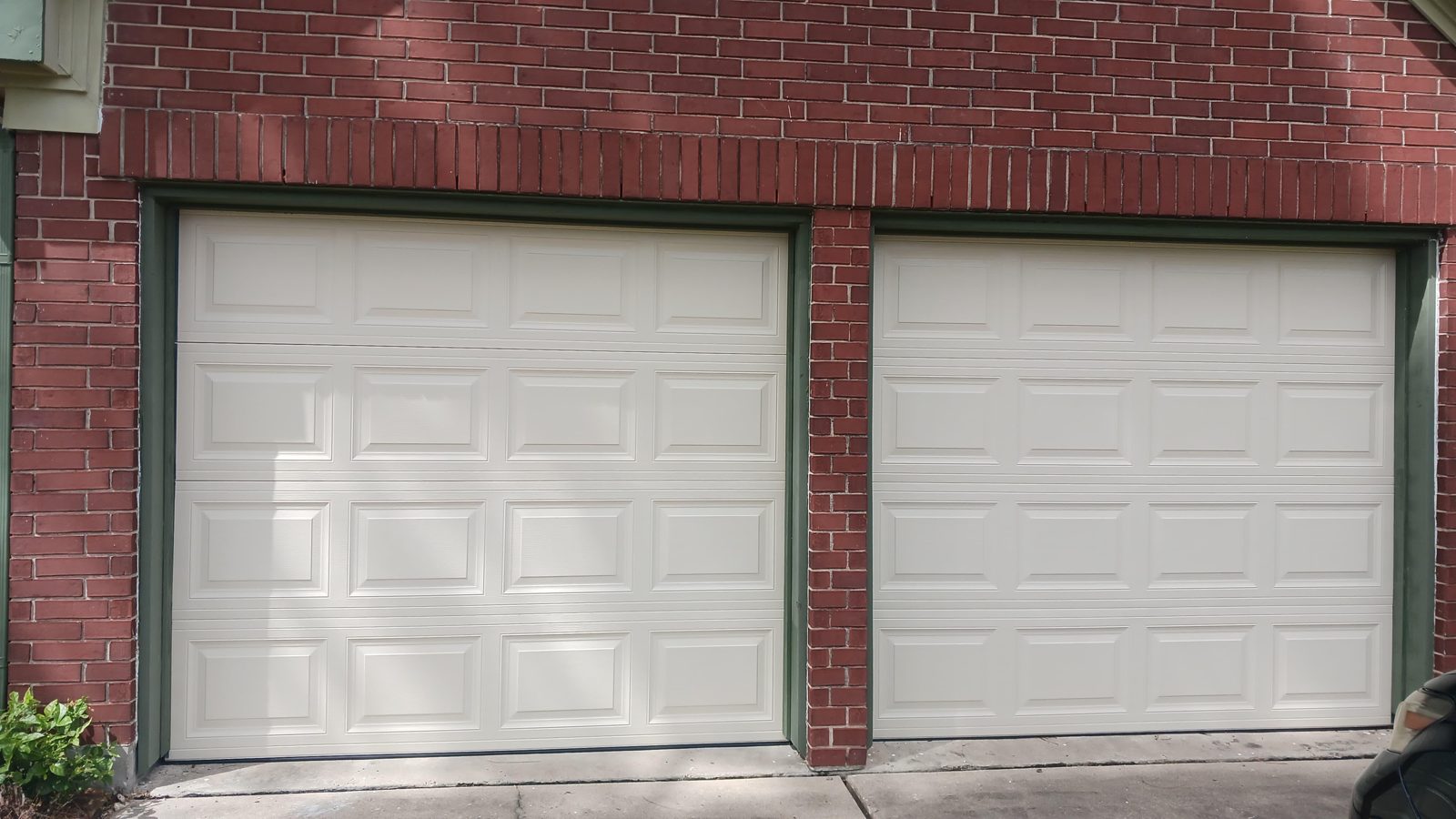 Newly installed residential garage door on a Houston home