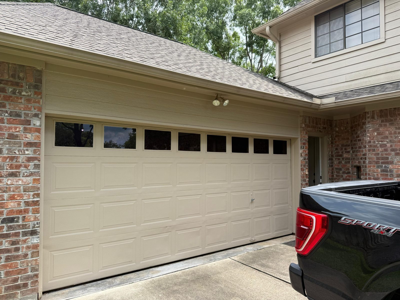 New garage door installed by TikTak on a Westbury, TX home