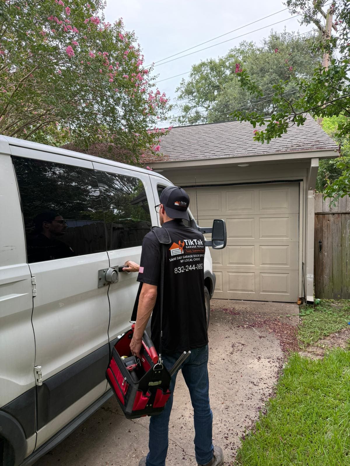 TikTak technician arriving for a residential garage door repair in Houston