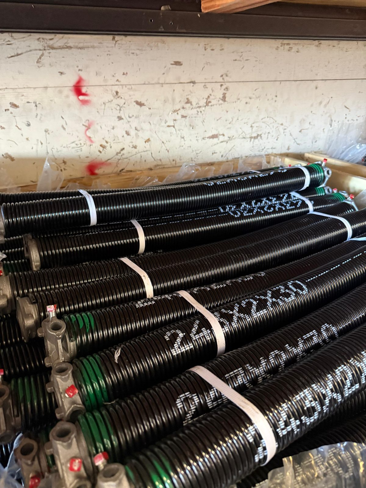 Close-up of a high-cycle torsion spring on a Houston garage door
